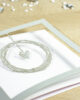 PALUXA_Liebe_im_Mittelpunkt_Silber_detail1.jpg Zoom-In PALUXA Lasercut-Hochzeitskarte mit Herz Motiv, silber, liegend.