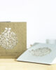 PALUXA_Florale_Weihnachtskugel_Varianten.jpg Zwei Farbvarianten PALUXA Lasercut-Weihnachtskarte mit Floraler Weihnachtskugel, in Farben Brownsilver und Silber.